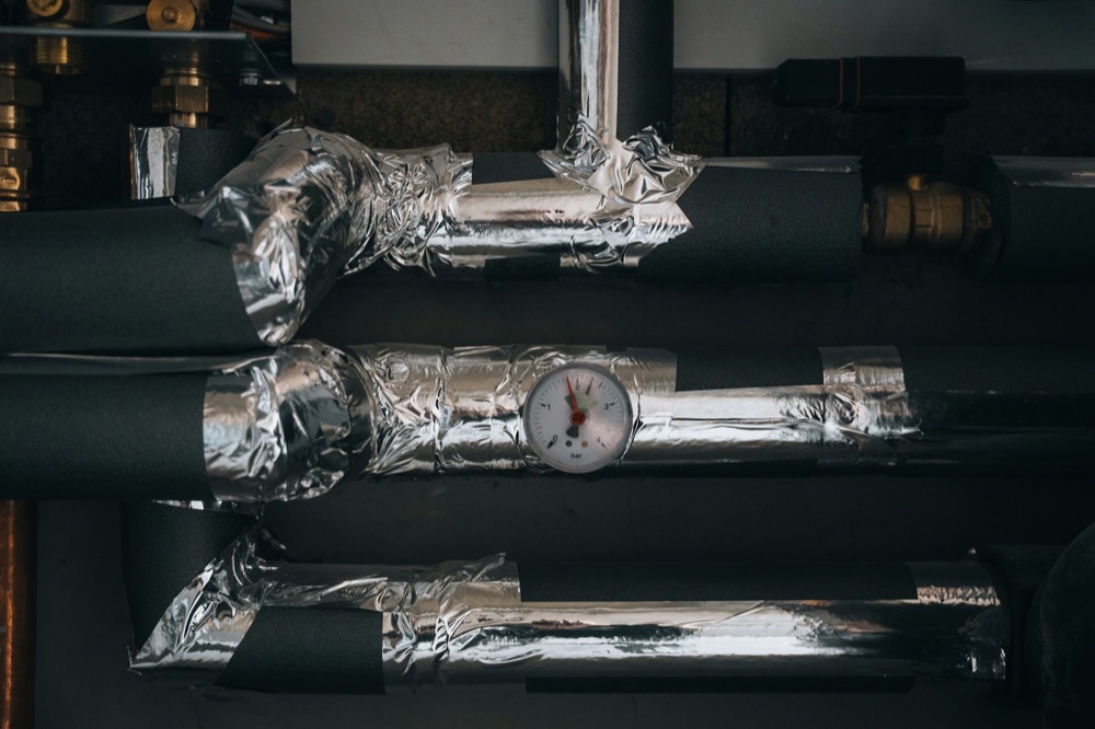 Hydronic in-floor radiant heating installation in a home under construction